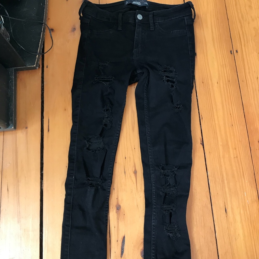 Super distressed black skinny jeans